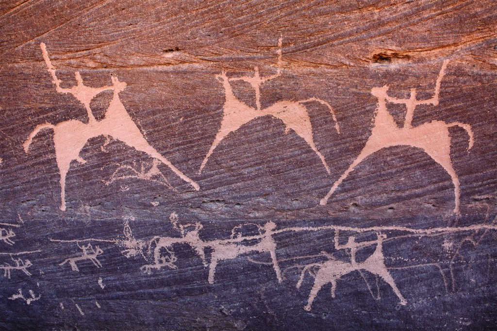 Close-up of Painted Bull petroglyph, at Biâ€™r Hima, showing cavalrymen with swords and lances.